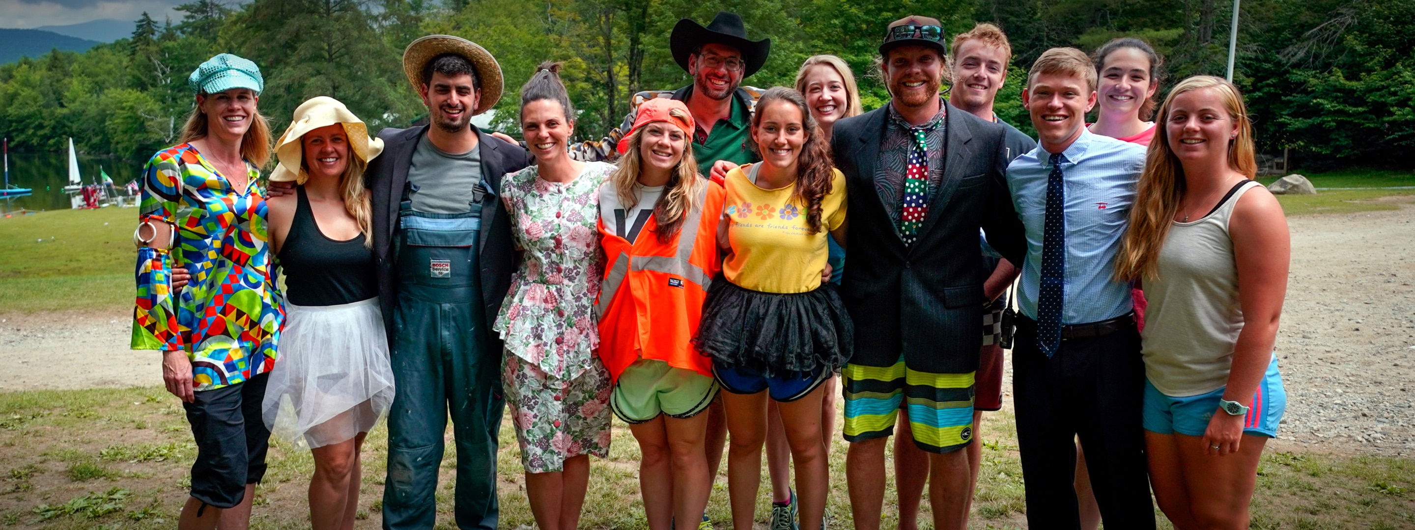 a group of counselors and instructors dressed up in costumes