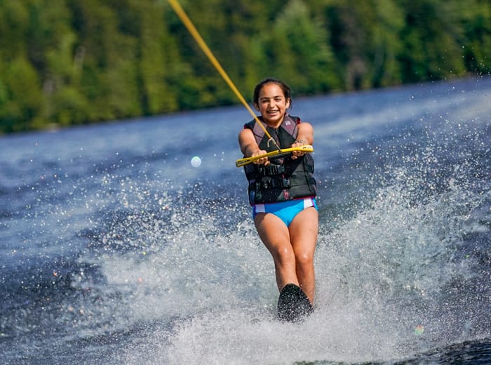 young girl water skiing