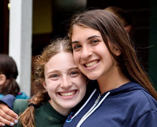 two girls smiling