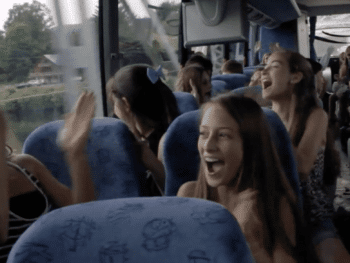 a bus full of happy girl screaming